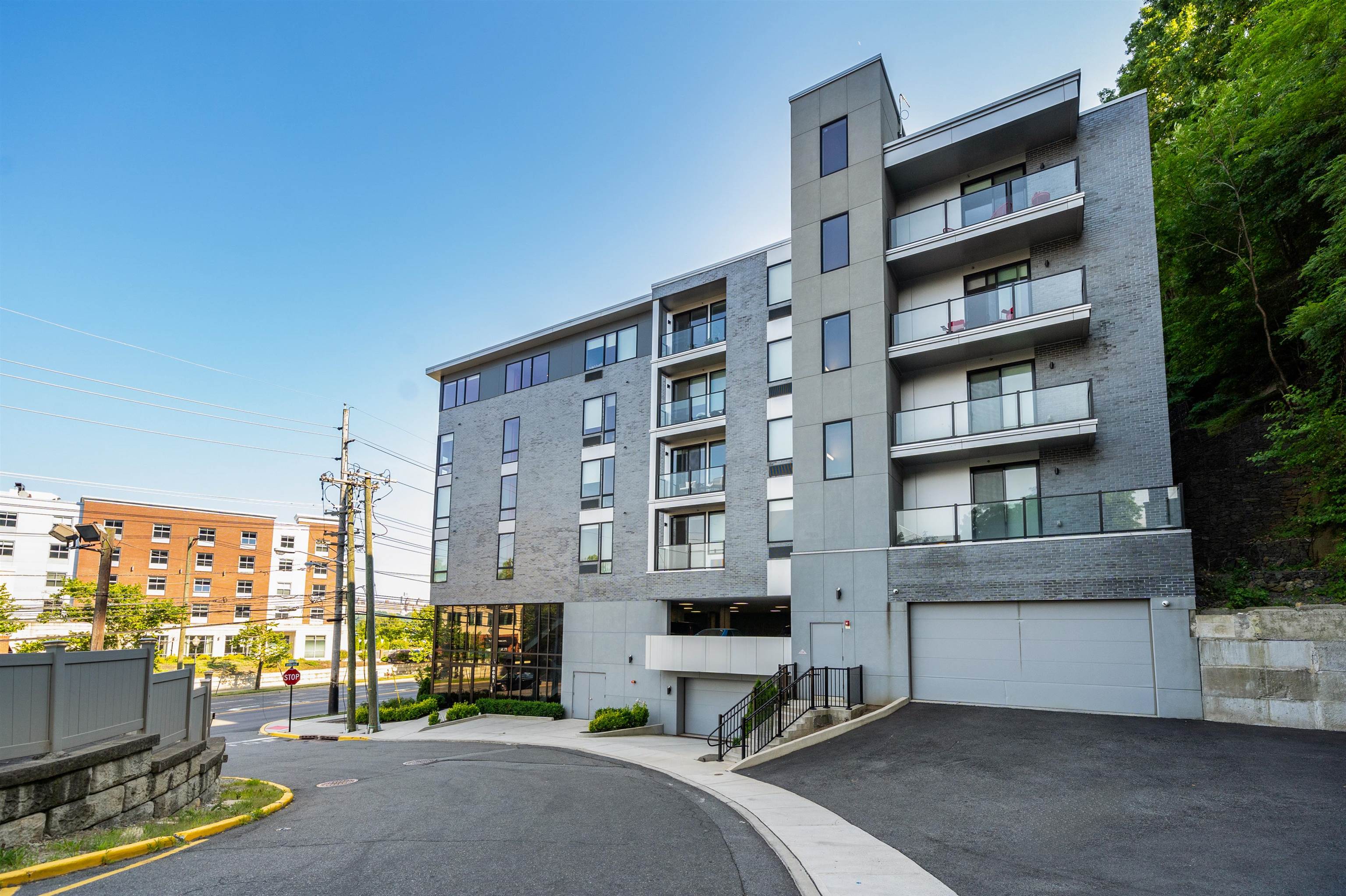 8621 River Road, Unit 6A North Bergen, NJ 07047 - Photo 40 of 42 a front view of a building with glass windows and door