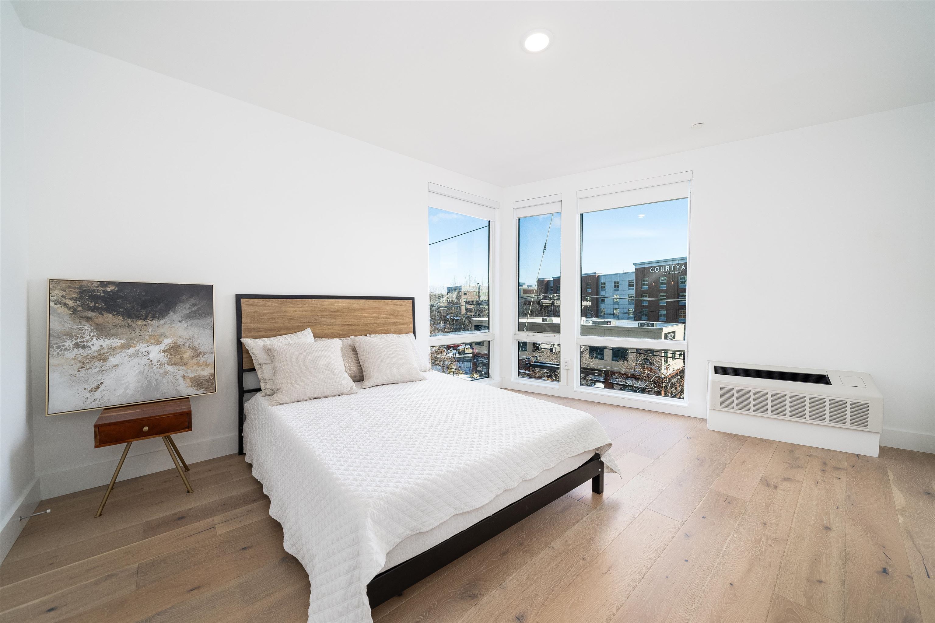 8621 River Road, Unit 6A North Bergen, NJ 07047 - Photo 6 of 42 a bedroom with a bed and table