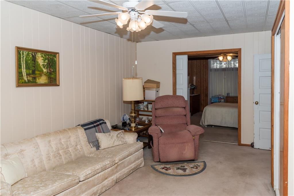911 Highview Street Pittsburgh, PA 15206 - Photo 5 of 17 First floor living room with pocket doors to a current bedroom