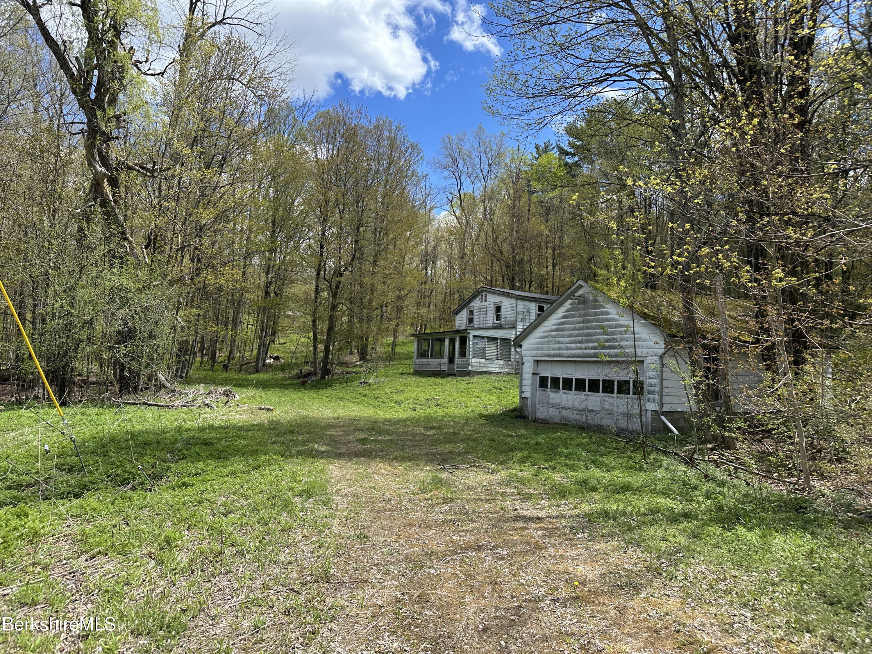 2447 State Road Richmond, MA 01254 - Photo 3 of 13 a view of a house with a yard