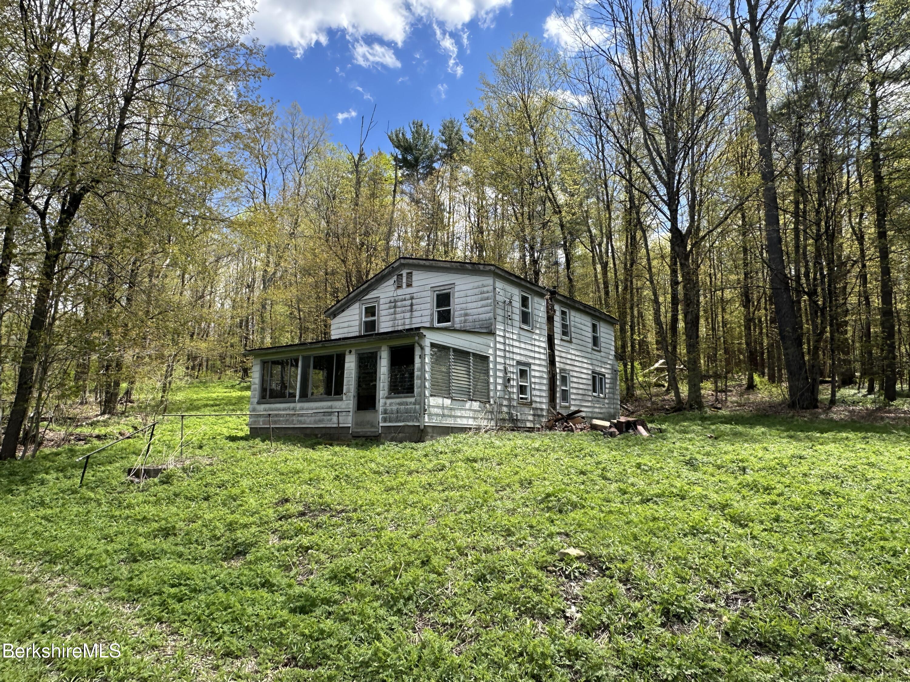 2447 State Road Richmond, MA 01254 - Photo 5 of 13 a view of a house with a yard