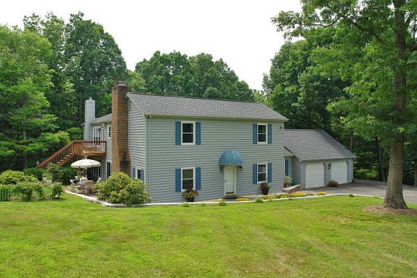 215 W Road Blue Ridge, VA 24064 - Photo 1 of 47 a house that has a big yard with large trees