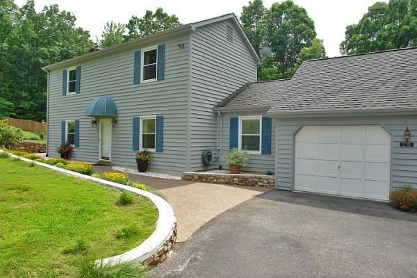215 W Road Blue Ridge, VA 24064 - Photo 2 of 47 a house view with a backyard space