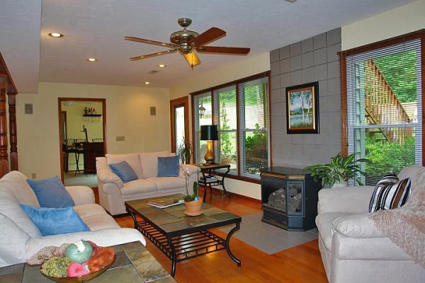215 W Road Blue Ridge, VA 24064 - Photo 15 of 47 a living room with furniture and large windows