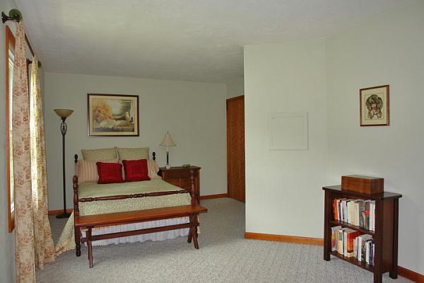 215 W Road Blue Ridge, VA 24064 - Photo 25 of 47 a bedroom with furniture and a book shelf