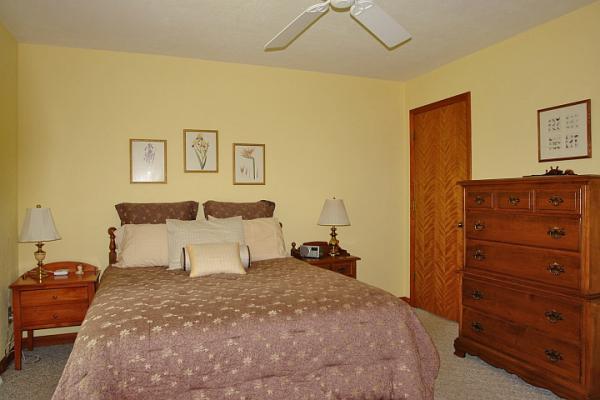 215 W Road Blue Ridge, VA 24064 - Photo 26 of 47 a bedroom with a bed and a dresser