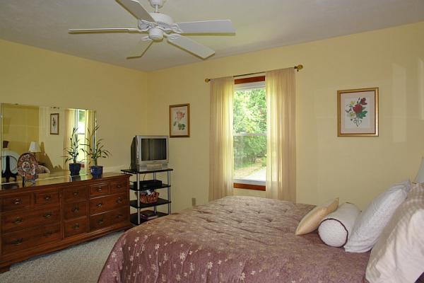 215 W Road Blue Ridge, VA 24064 - Photo 27 of 47 a bedroom with a bed and furniture with window