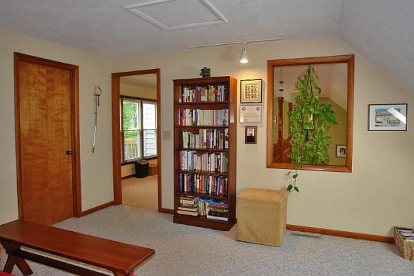 215 W Road Blue Ridge, VA 24064 - Photo 30 of 47 a living room with furniture and a bookshelf