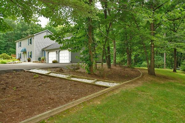 215 W Road Blue Ridge, VA 24064 - Photo 46 of 47 a view of a house with a backyard and a tree