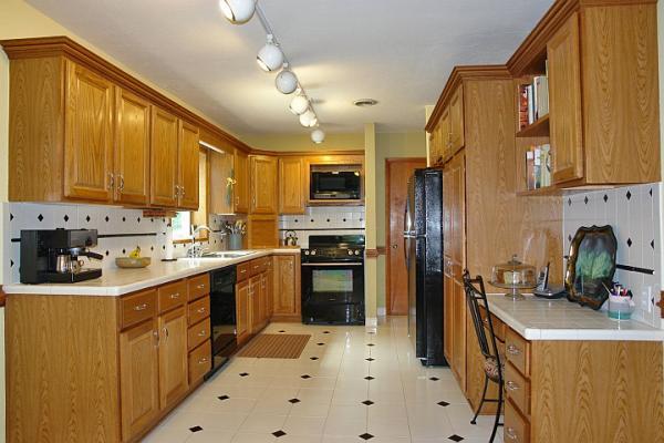 215 W Road Blue Ridge, VA 24064 - Photo 9 of 47 a kitchen with stainless steel appliances a stove refrigerator sink and cabinets