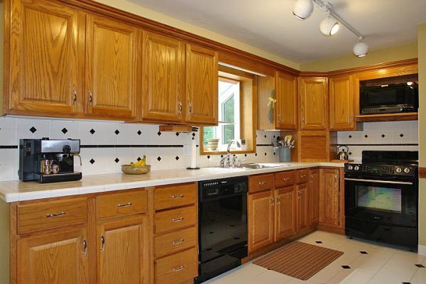 215 W Road Blue Ridge, VA 24064 - Photo 10 of 47 a kitchen with stainless steel appliances a stove sink and cabinets