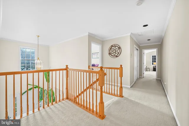 a view of a hallway with a stairs