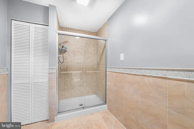 a bathroom with a shower and a bathtub