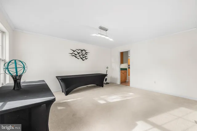 a bedroom with a bed and a desk