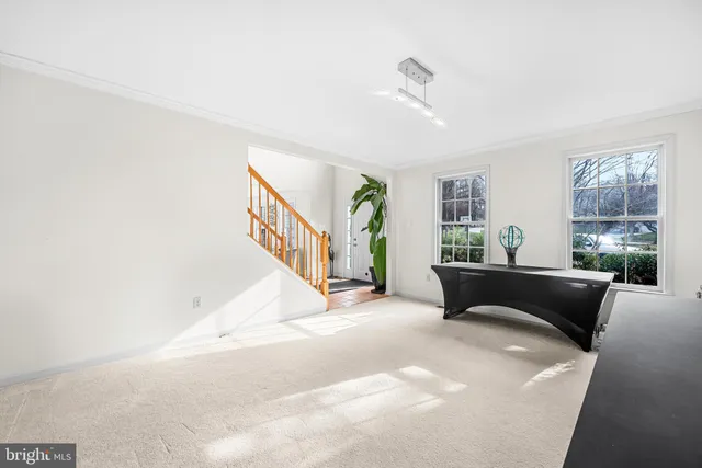 a living room with furniture and windows