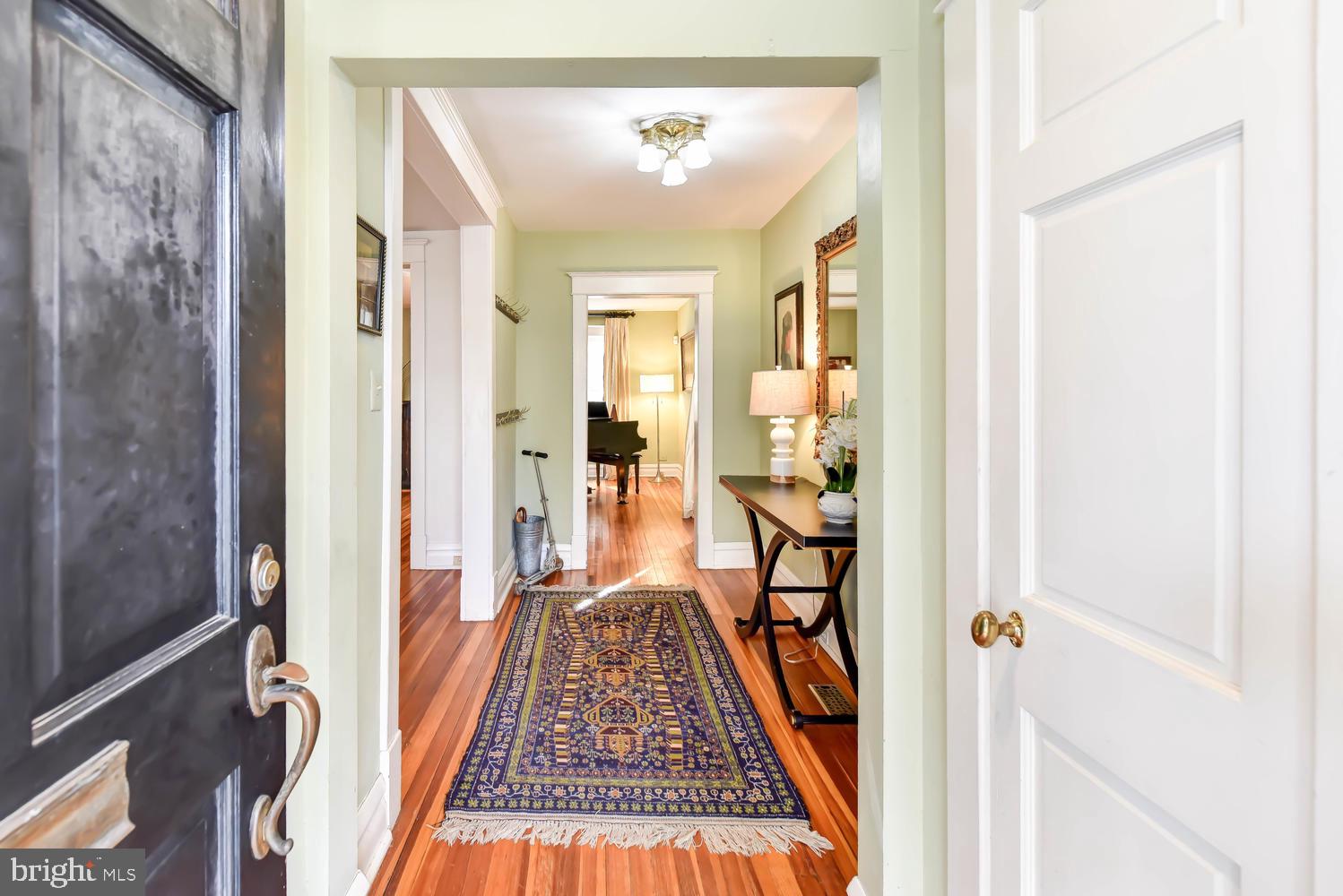 645 E Street Southeast Washington, DC 20003 - Photo 2 of 57 a view of a hallway with a livingroom and furniture
