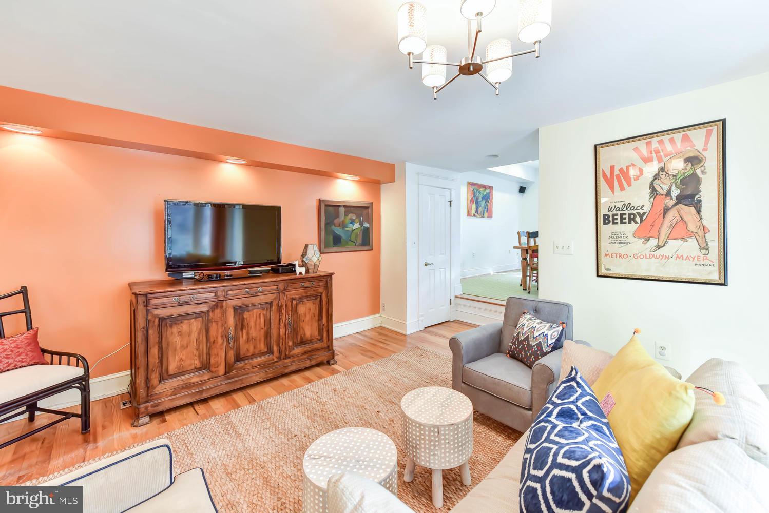 645 E Street Southeast Washington, DC 20003 - Photo 16 of 57 a living room with furniture and a flat screen tv