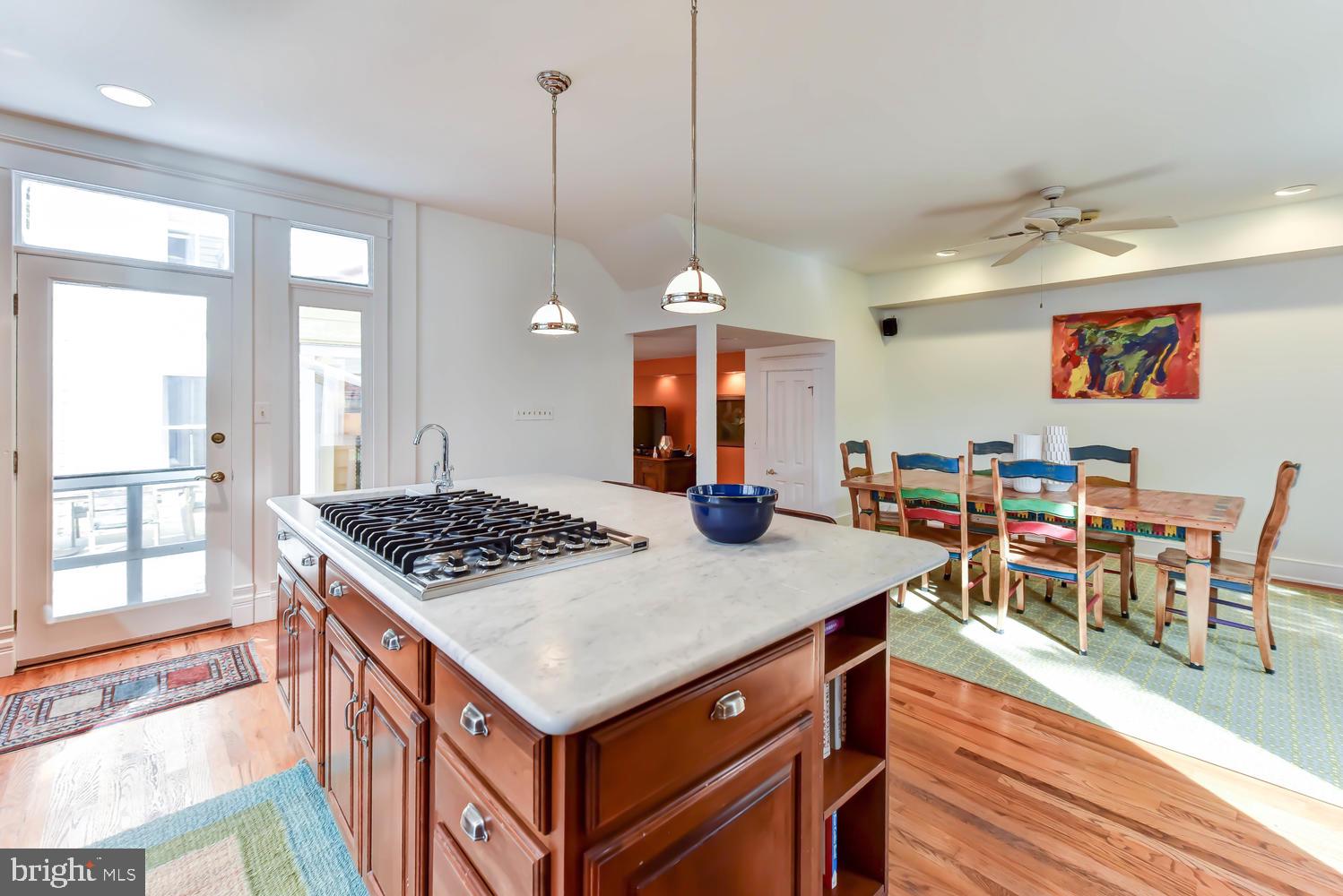 645 E Street Southeast Washington, DC 20003 - Photo 21 of 57 a view of kitchen island with furniture and wooden floor