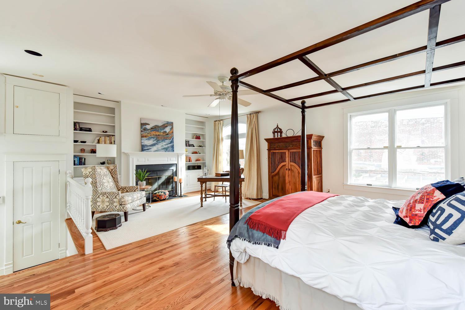 645 E Street Southeast Washington, DC 20003 - Photo 26 of 57 a bedroom with a bed and wooden floor