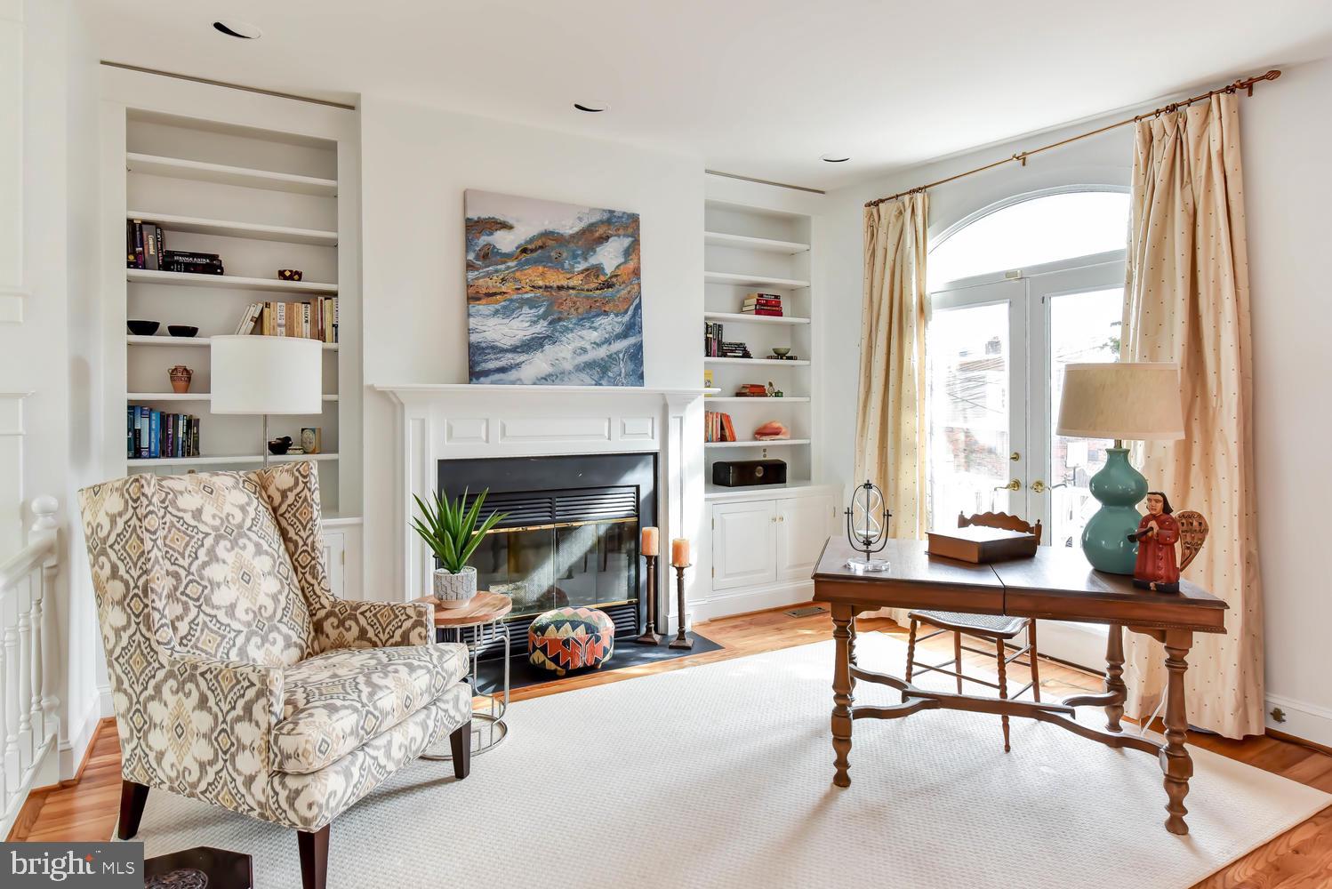 645 E Street Southeast Washington, DC 20003 - Photo 29 of 57 a living room with furniture and a fireplace