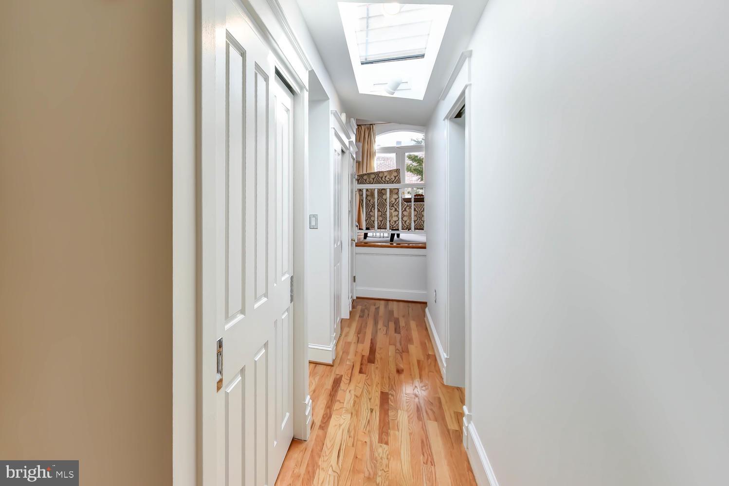 645 E Street Southeast Washington, DC 20003 - Photo 30 of 57 a view of a hallway with wooden floor and a bathroom
