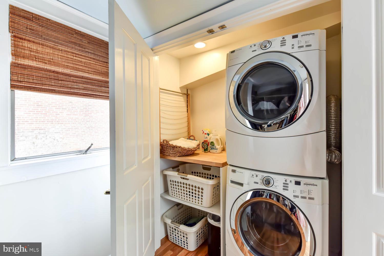 645 E Street Southeast Washington, DC 20003 - Photo 32 of 57 a view of a bedroom with washer and dryer