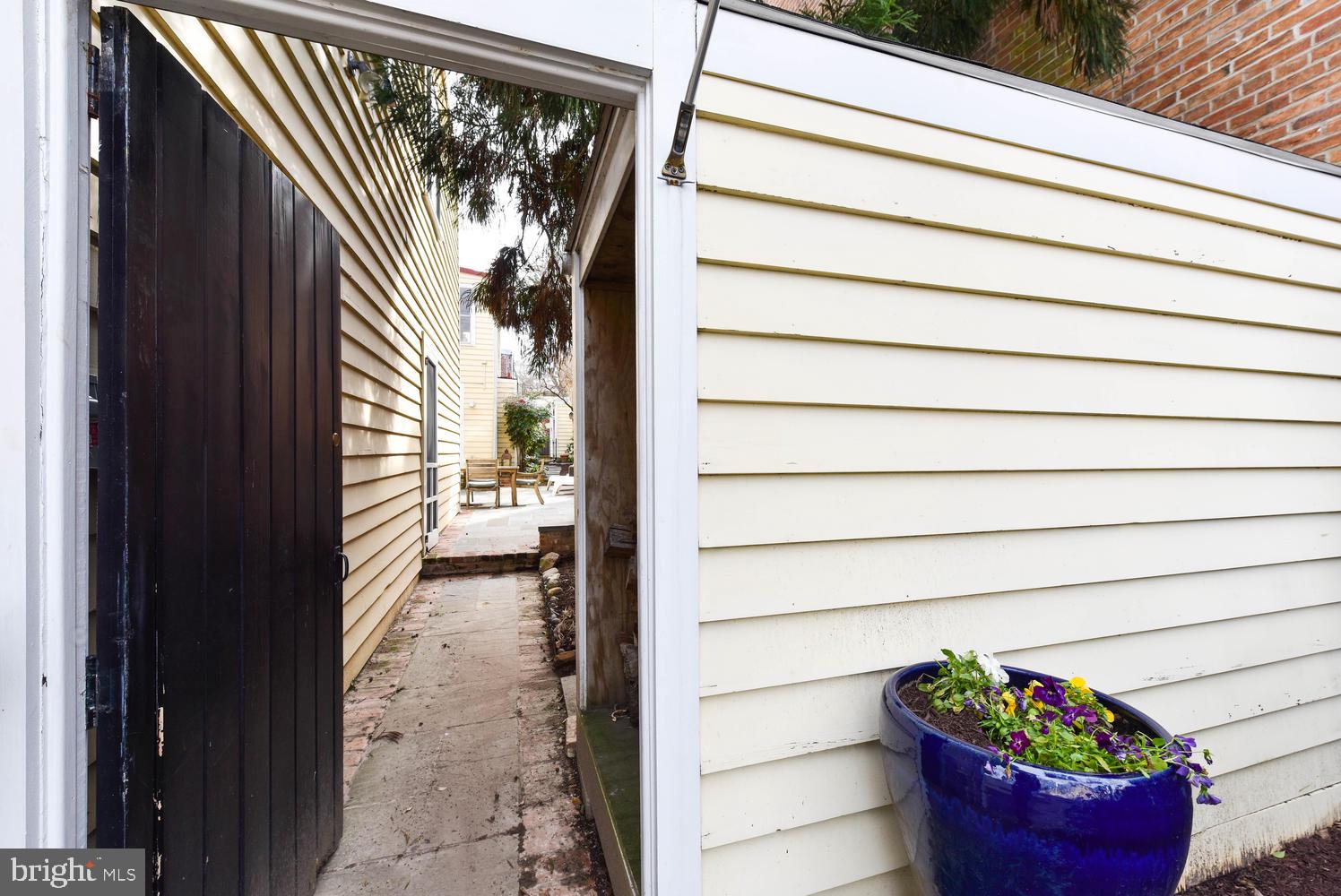 645 E Street Southeast Washington, DC 20003 - Photo 44 of 57 Front privacy gate w/ wood storage & bike shed