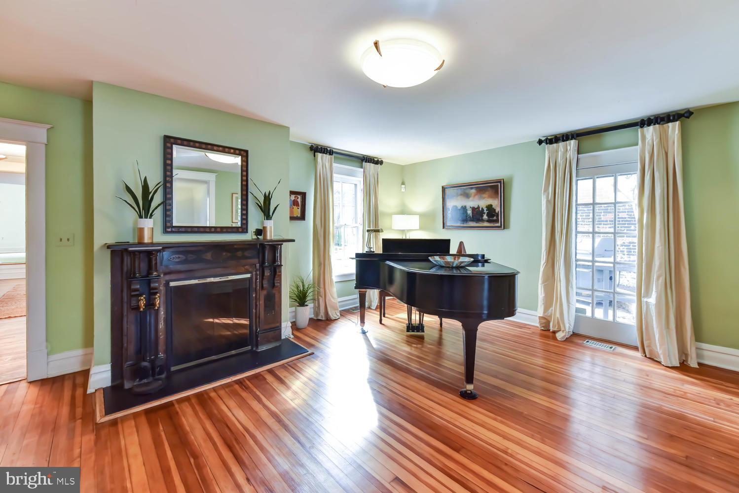 645 E Street Southeast Washington, DC 20003 - Photo 7 of 57 a living room with furniture and a fireplace