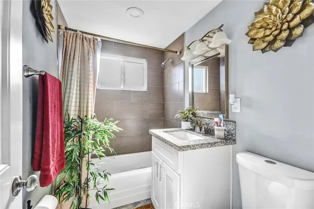 a house view with a sitting space and garden