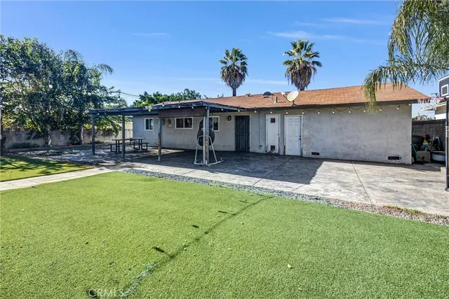 a view of a chairs and table in the patio