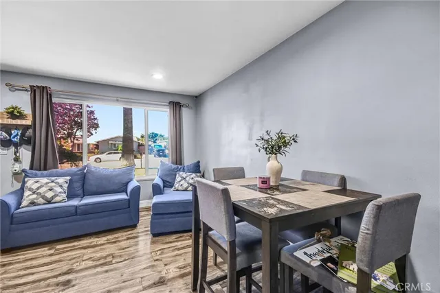 a living room with furniture a table and a potted plant