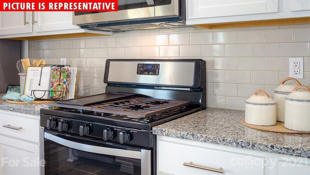 106 Sierra Road Mooresville, NC 28117 - Photo 13 of 32 a stove top oven sitting inside of a kitchen