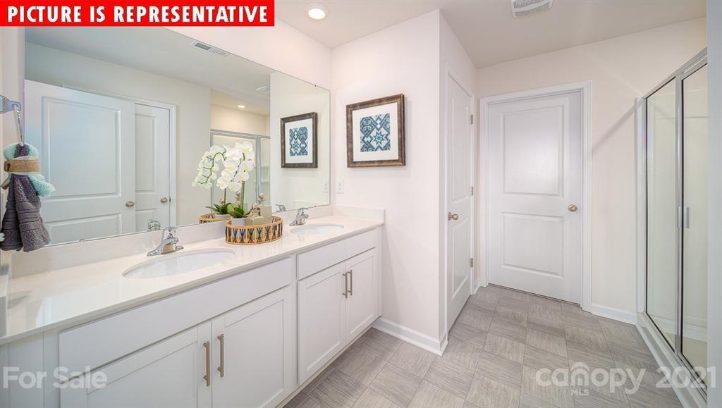 106 Sierra Road Mooresville, NC 28117 - Photo 22 of 32 a bathroom with a sink and a mirror