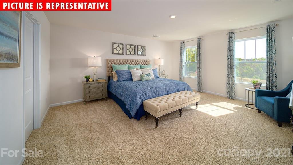 106 Sierra Road Mooresville, NC 28117 - Photo 24 of 32 a bed room with a bed and a couch