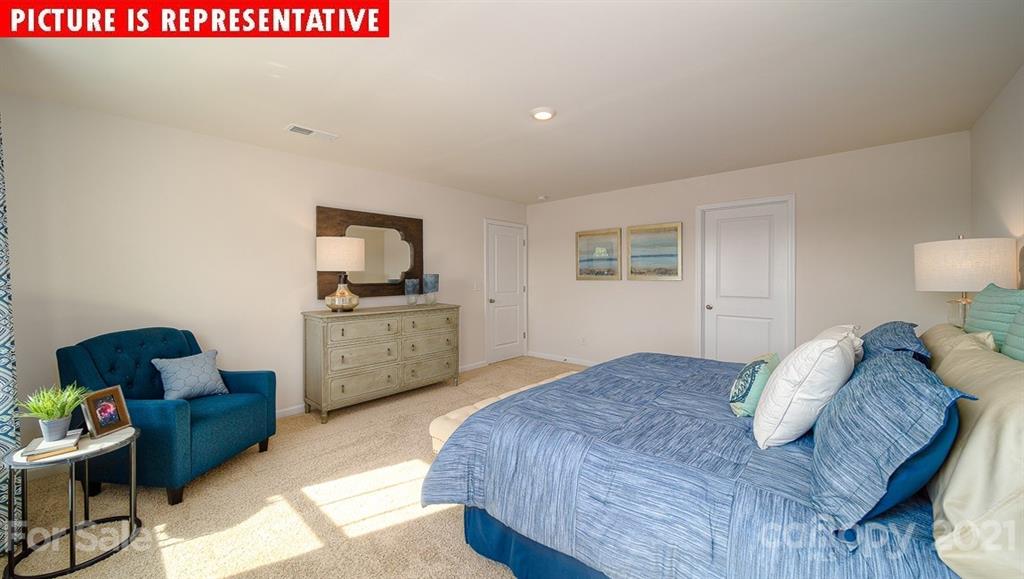 106 Sierra Road Mooresville, NC 28117 - Photo 25 of 32 a bedroom with a bed and a couch
