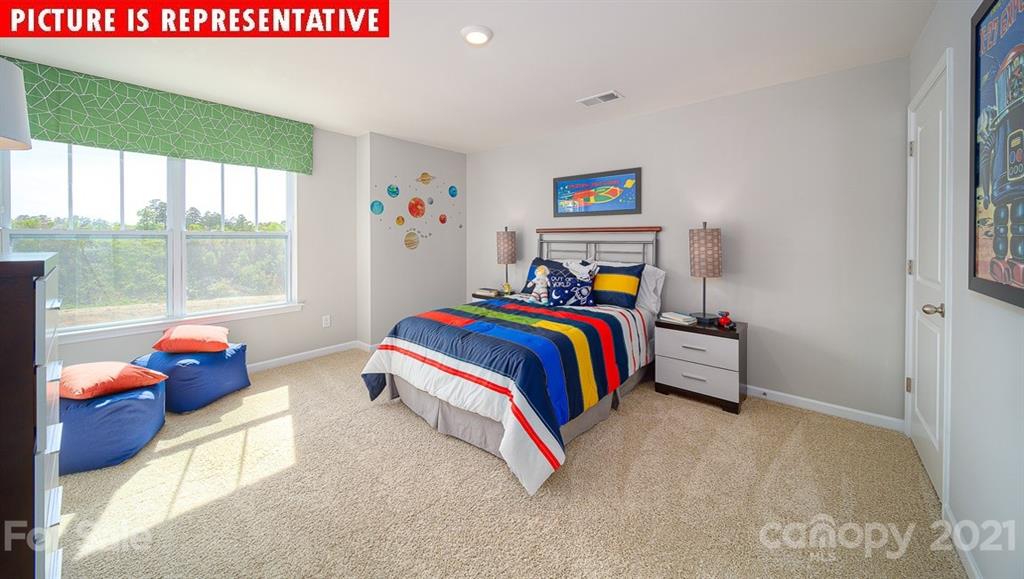 106 Sierra Road Mooresville, NC 28117 - Photo 28 of 32 a bedroom with a bed and a window