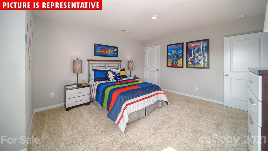 106 Sierra Road Mooresville, NC 28117 - Photo 29 of 32 a bed room with a bed and a couch