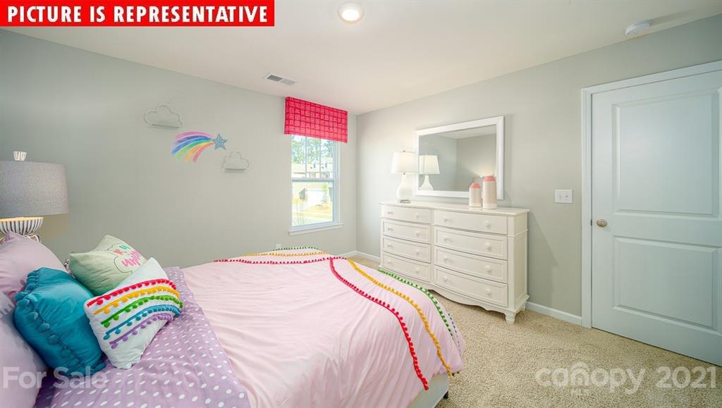 106 Sierra Road Mooresville, NC 28117 - Photo 31 of 32 a bedroom with a bed and a dresser