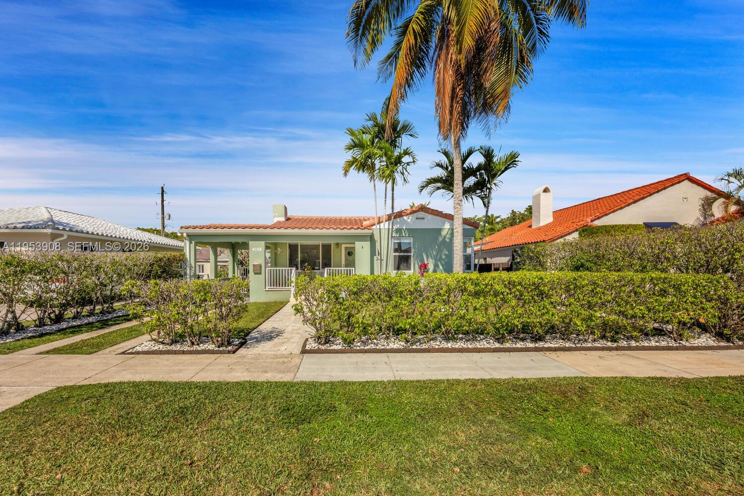 2431 Southwest 22nd Terrace Miami, FL 33145 - Photo 5 of 16 a front view of a house with a yard