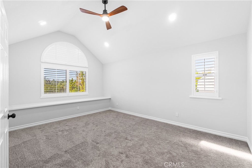 26433 Emerald Dove Drive Valencia, CA 91355 - Photo 12 of 50 an empty room with windows and fan