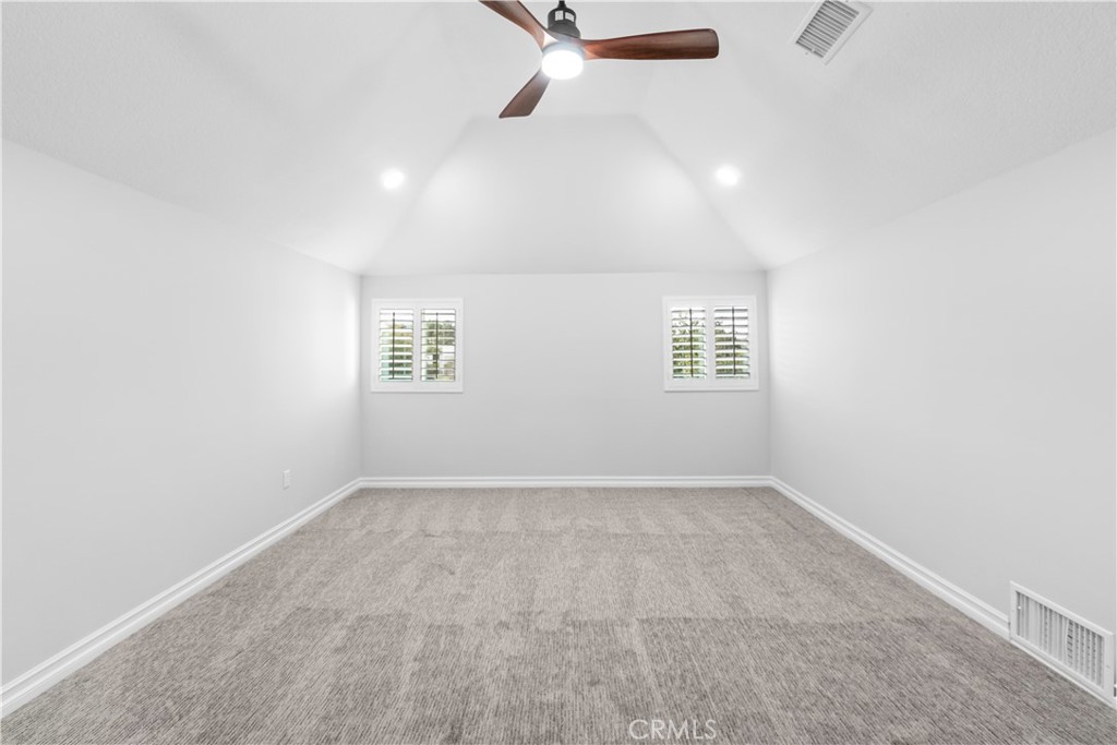 26433 Emerald Dove Drive Valencia, CA 91355 - Photo 18 of 50 an empty room with windows and fan