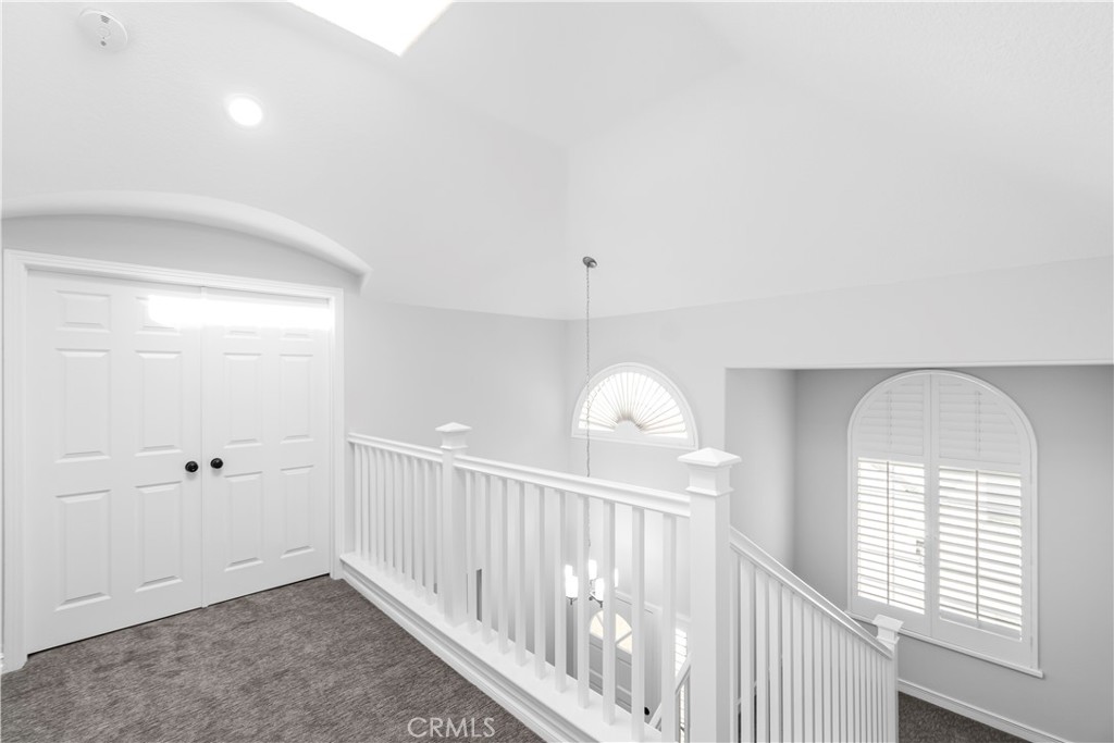 26433 Emerald Dove Drive Valencia, CA 91355 - Photo 20 of 50 wooden floor in a hall with a window