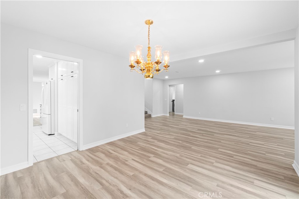 26433 Emerald Dove Drive Valencia, CA 91355 - Photo 21 of 50 a view of a livingroom with a chandelier fan and a window