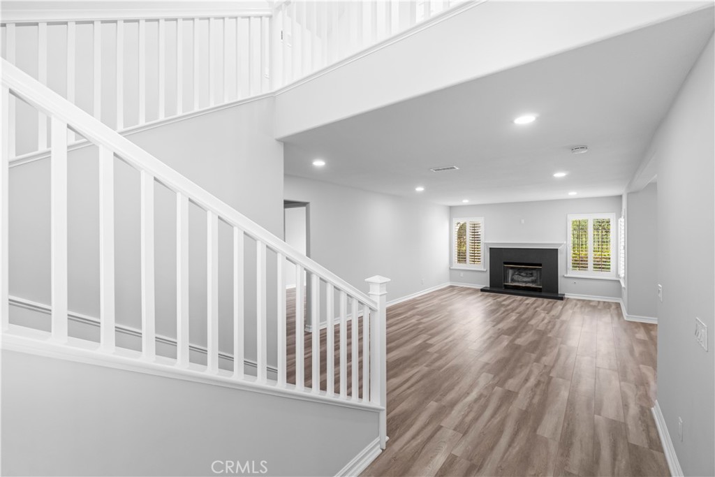 26433 Emerald Dove Drive Valencia, CA 91355 - Photo 22 of 50 a view of a livingroom with wooden floor and staircase