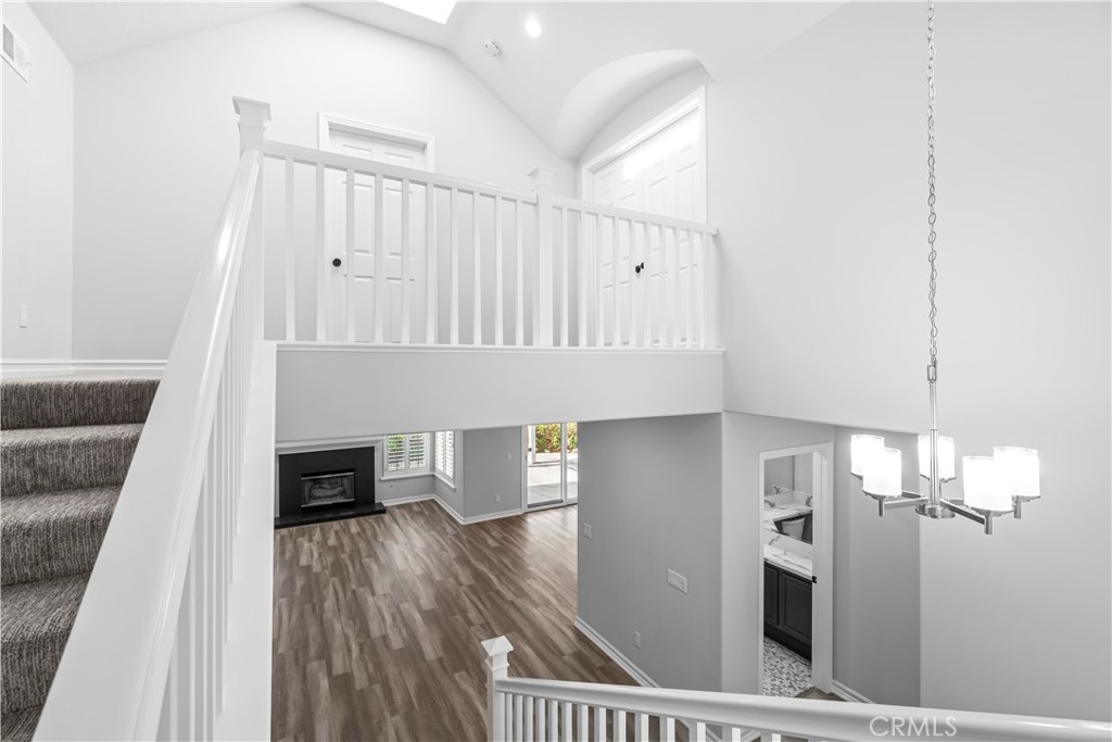 26433 Emerald Dove Drive Valencia, CA 91355 - Photo 23 of 50 a view of livingroom and dining room with wooden floor