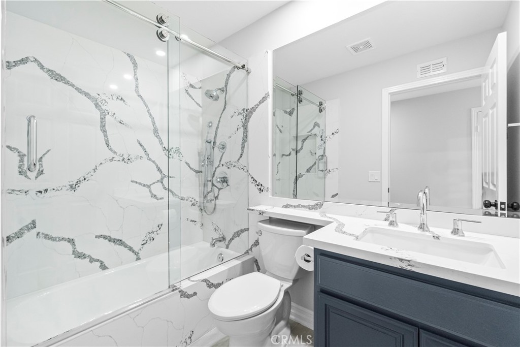 26433 Emerald Dove Drive Valencia, CA 91355 - Photo 24 of 50 a bathroom with a sink toilet and shower