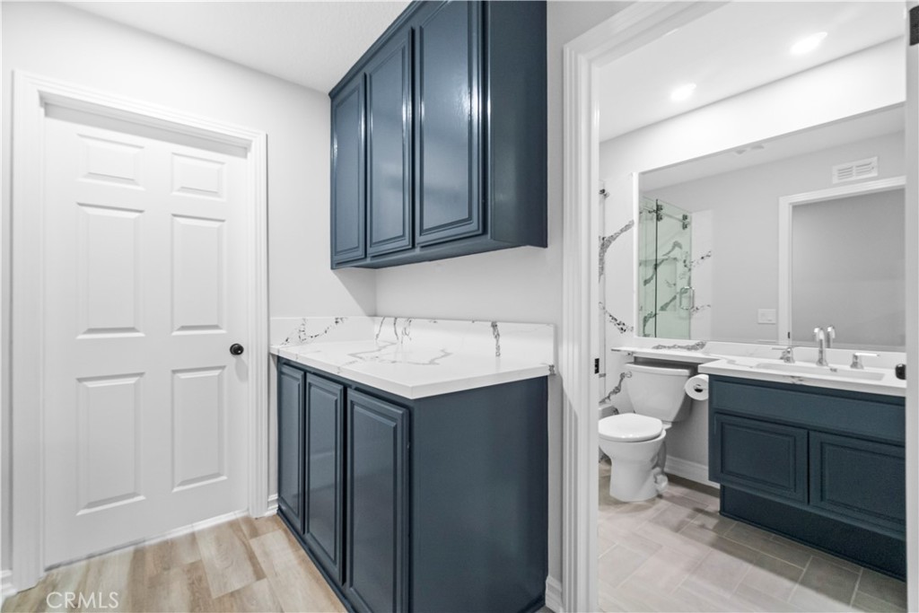 26433 Emerald Dove Drive Valencia, CA 91355 - Photo 25 of 50 a bathroom with a sink and a mirror
