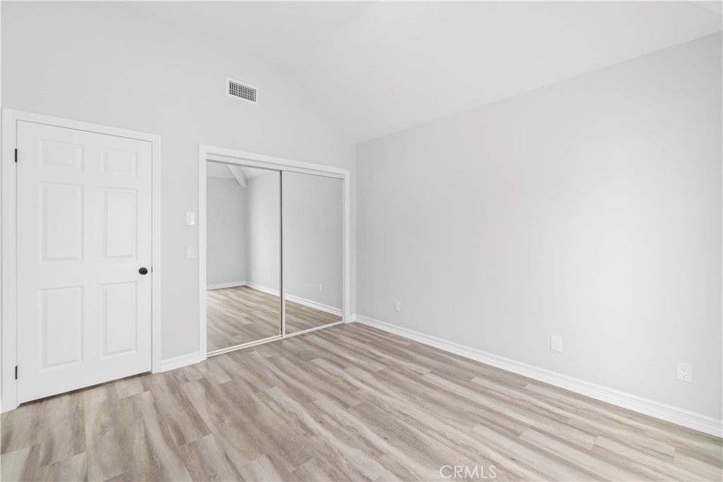 26433 Emerald Dove Drive Valencia, CA 91355 - Photo 29 of 50 a view of empty room with wooden floor