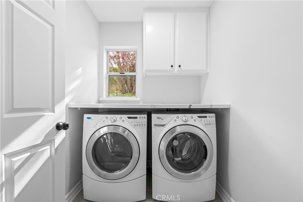 26433 Emerald Dove Drive Valencia, CA 91355 - Photo 30 of 50 a utility room with dryer and washer