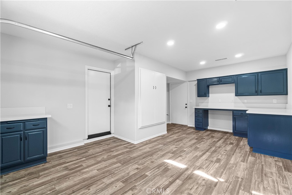 26433 Emerald Dove Drive Valencia, CA 91355 - Photo 35 of 50 a view of a kitchen with wooden floor